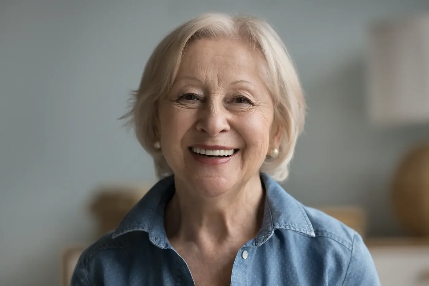 Smiling older woman with a full, natural-looking smile